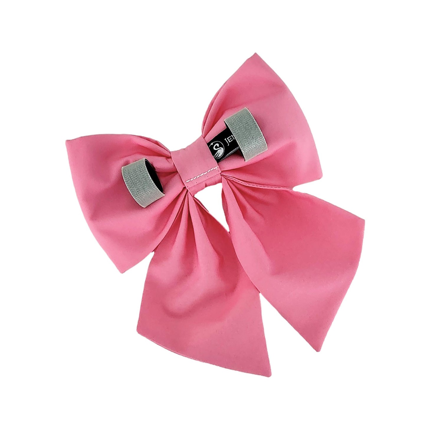 The back view of a bubblegum pink dog bow with Velcro tapes to attach to to the collar.