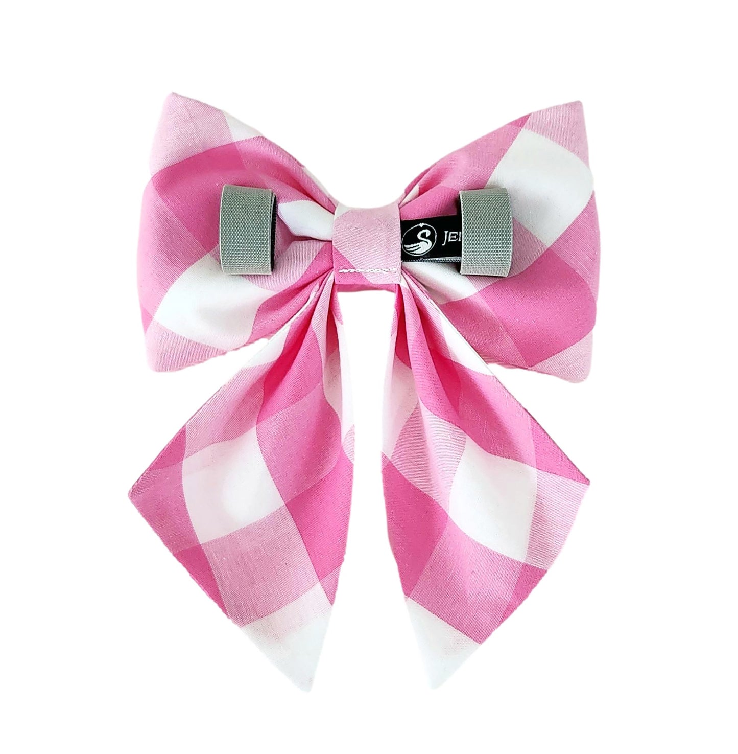 The back of a dog sailor bow in pink and white check print with Velcro tapes for attaching the bow to the collar.