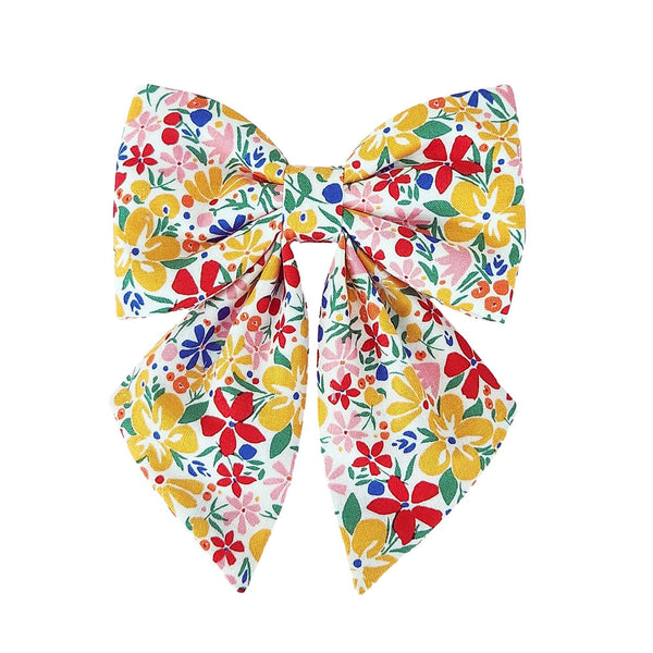 fun dog sailor bows that attach to the collar for small and large dogs with yellow red and pink flowers