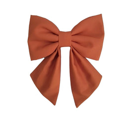 Rust dog sailor bows for small medium and large dogs that attach to the collar with Velcro Brand tape