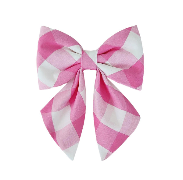 Dog sailor bows for small and large dogs that attach to the collar in pink buffalo check fabric