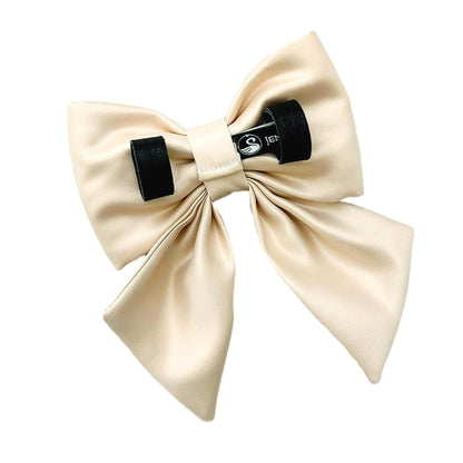 Beige satin dog bow with Velcro tapes on the back to attach to the collar.