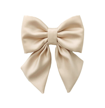 A dog sailor bow for the collar in beige matte satin fabric.