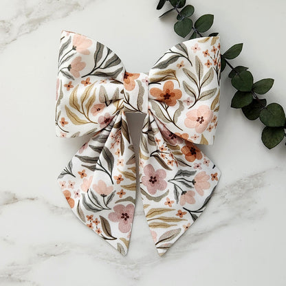 Dog sailor bow in floral garden print that attaches to the collar
