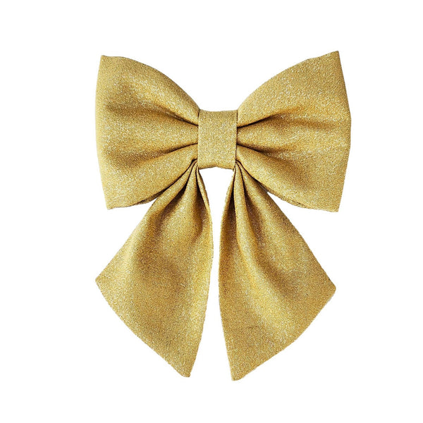 Sparkly bright gold dog sailor bows for puppies small medium and large dogs that attache to the collar