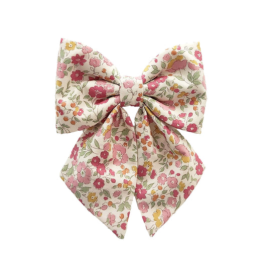 dog collar bows for large and small girl dogs and puppies in a soft pink flower print