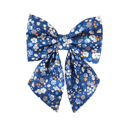 Blue floral bows for girl dogs that attach to the collar in small and large sizes