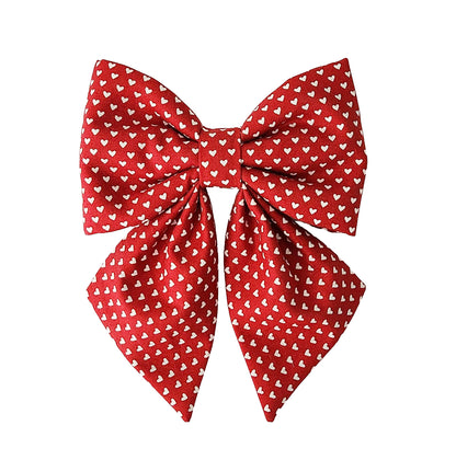Red bows for dogs with tiny white hearts that attaches to the collar for small and large dogs.