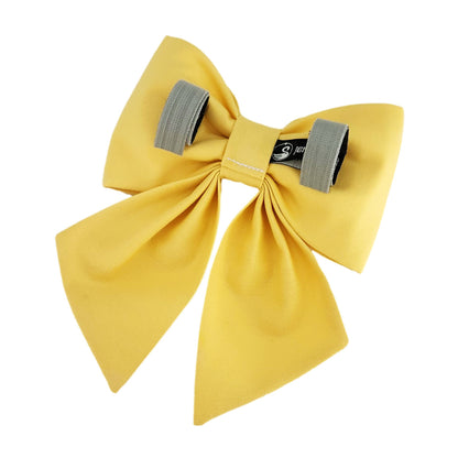 A yellow cotton dog sailor bow with Velcro tapes to attach to the collar.