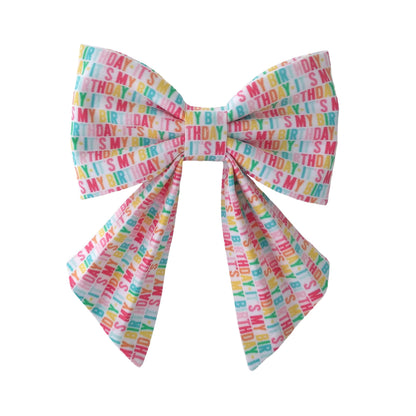 Dog birthday bow that attaches to the collar in a colorful it's my birthday cotton print