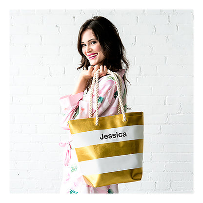 model with metallic gold and white stripe tote